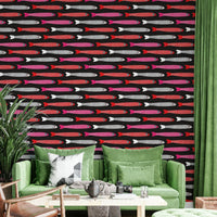 Red pink white fish on black background
