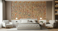 Ancient Glyphs wallpaper mural of hieroglyph columns above a grey bed between two white armchairs in a bedroom