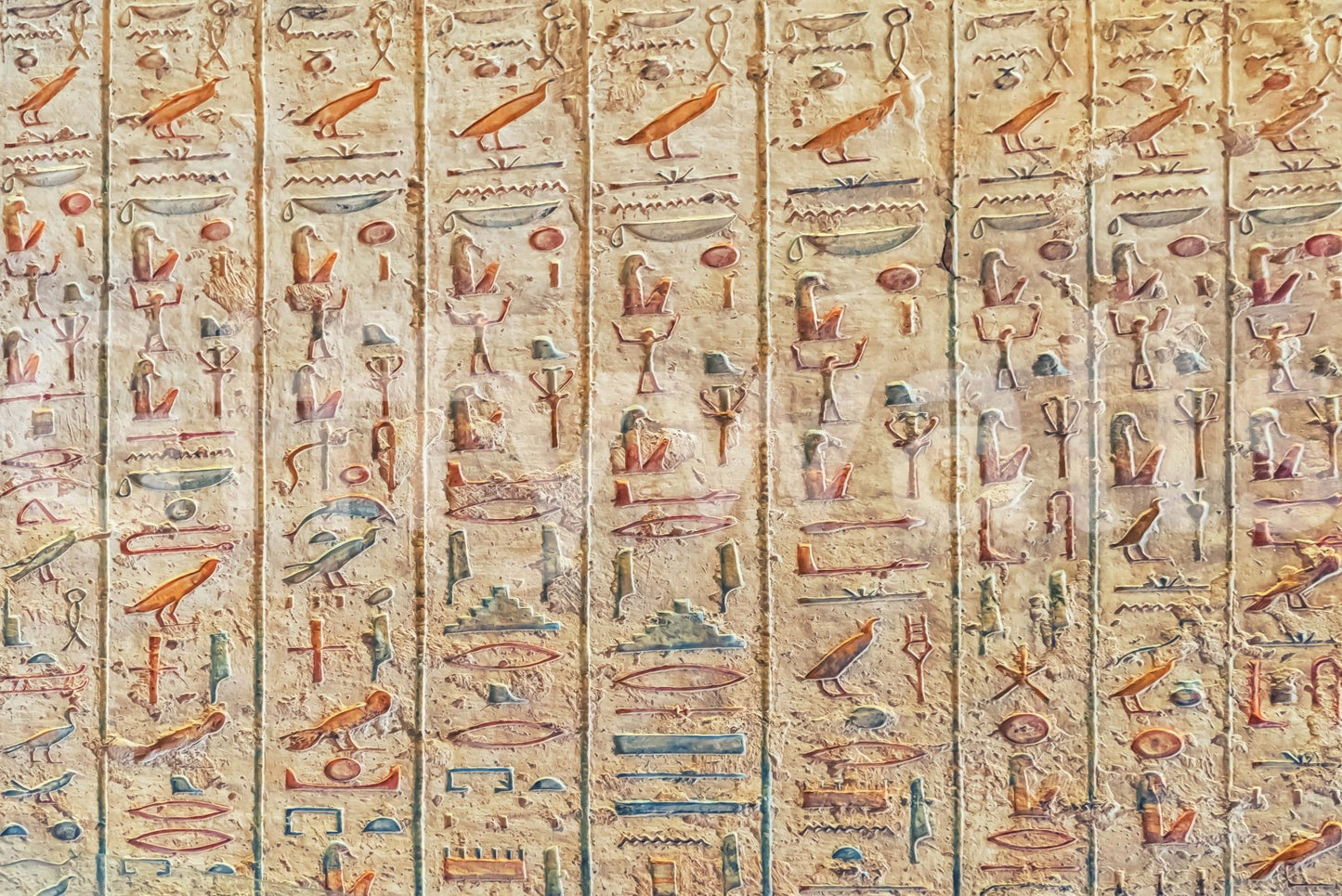 Ancient Glyphs wallpaper mural close-up of carved orange and teal Egyptian hieroglyphs on weathered stone