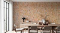 Ancient Inscriptions wallpaper mural in soft orange behind an oval wood dining table beside a glass garden door