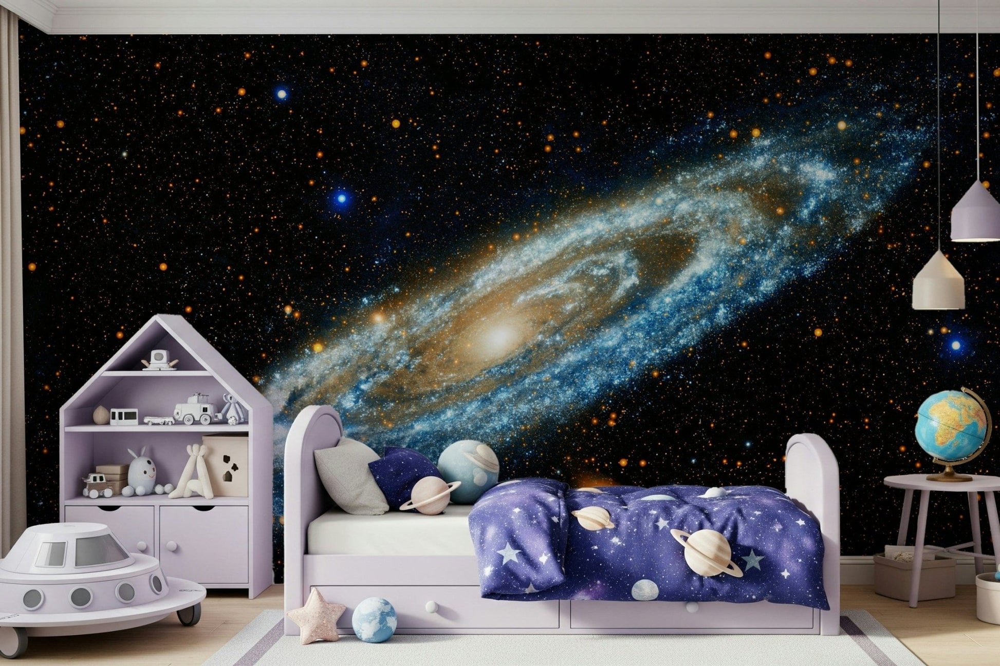 Andromeda galaxy mural in blue and gold above a lilac kids bed with planet bedding and a UFO toy