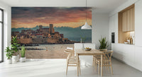 Mediterranean wall mural showing Antibes’ charming architecture silhouetted against a colorful dusk horizon.