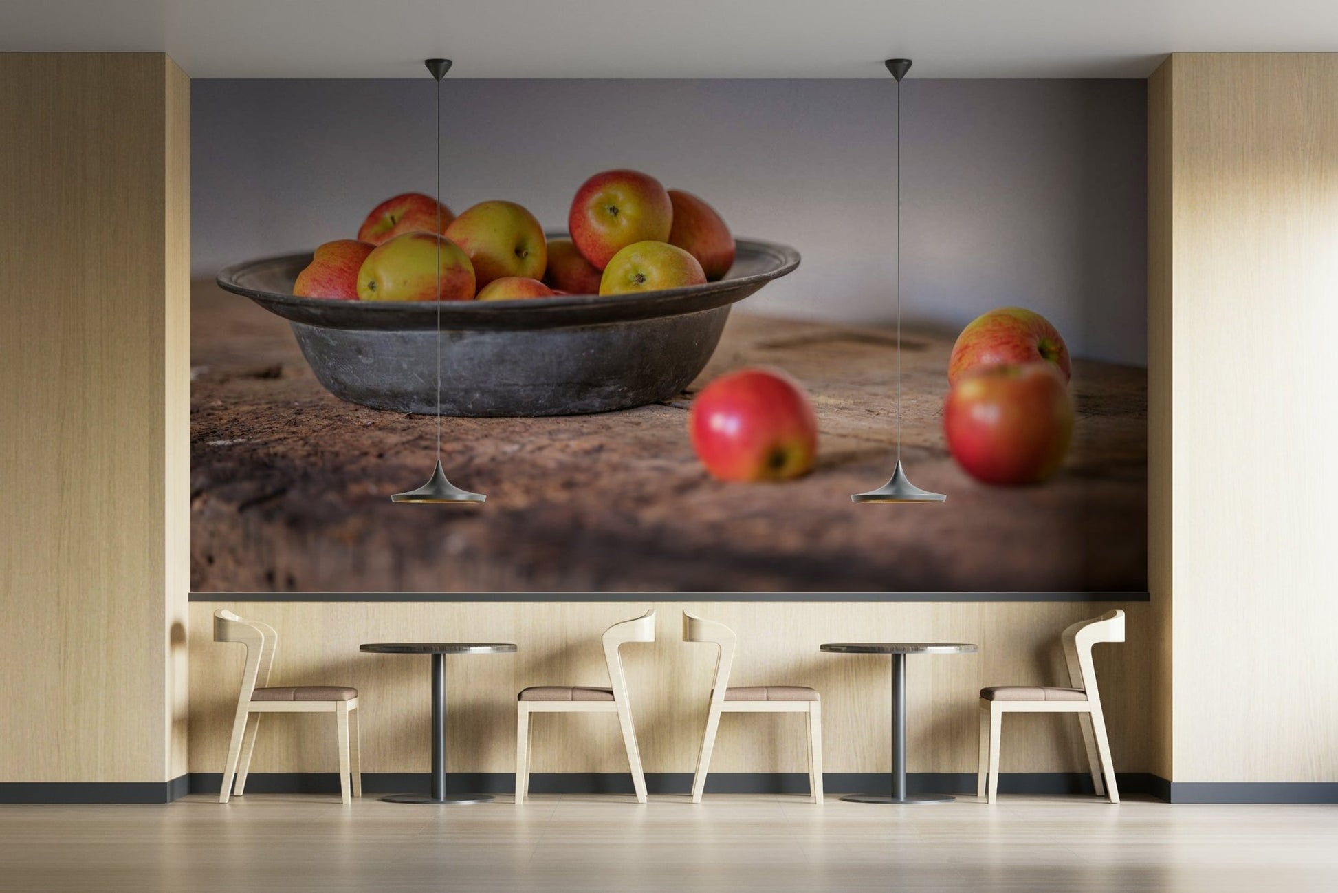 Bright apples in a simple metal bowl on rustic wood


