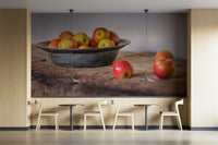 Bright apples in a simple metal bowl on rustic wood

