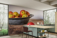 Fresh apples in a metal bowl on a rustic wooden table

