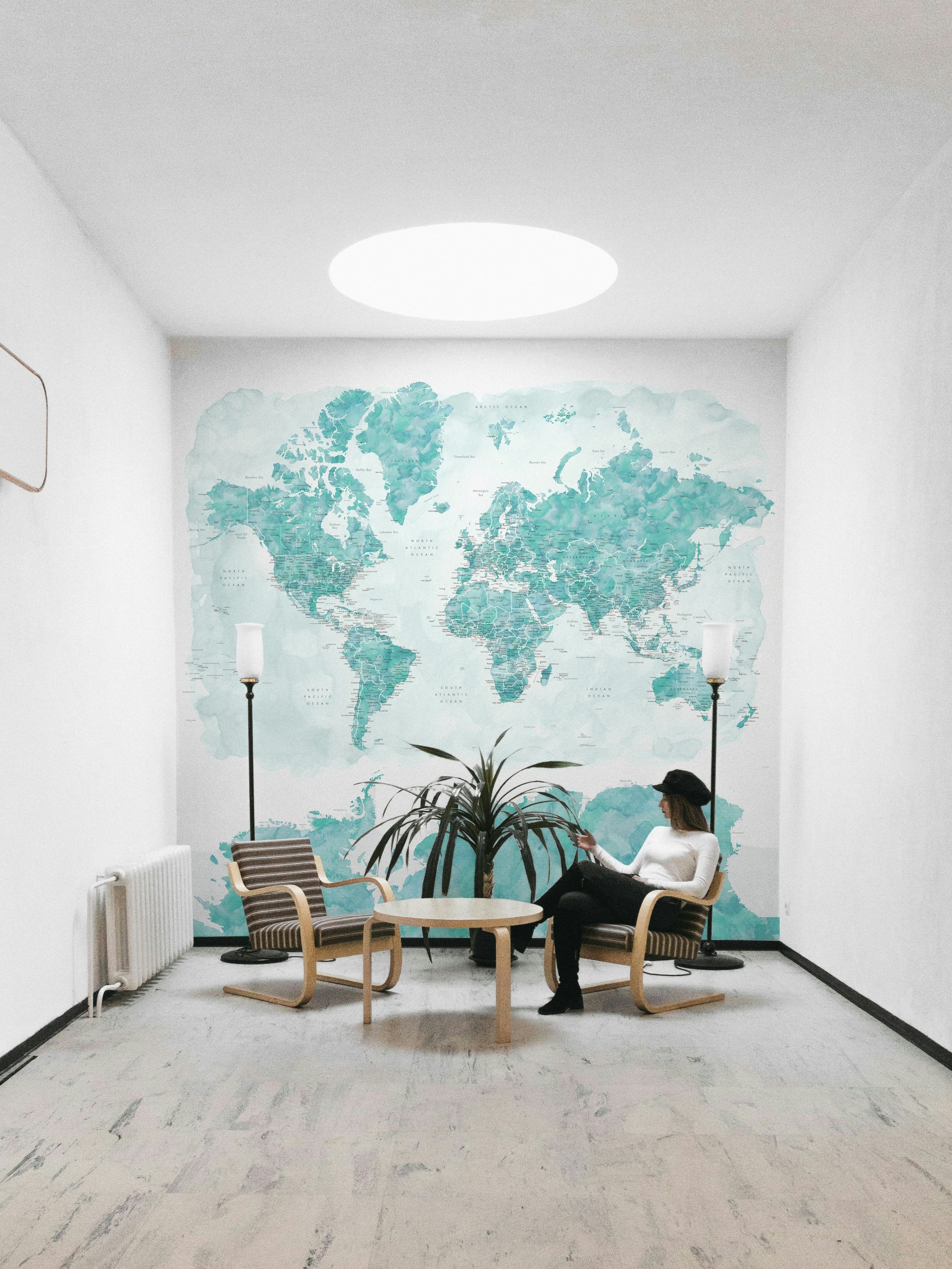 Watercolor world map with ocean-inspired blue palette

