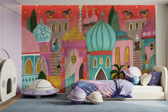 Arabian Nights wallpaper mural of a pink domed city behind a galaxy daybed with a lavender UFO toy and planet balls