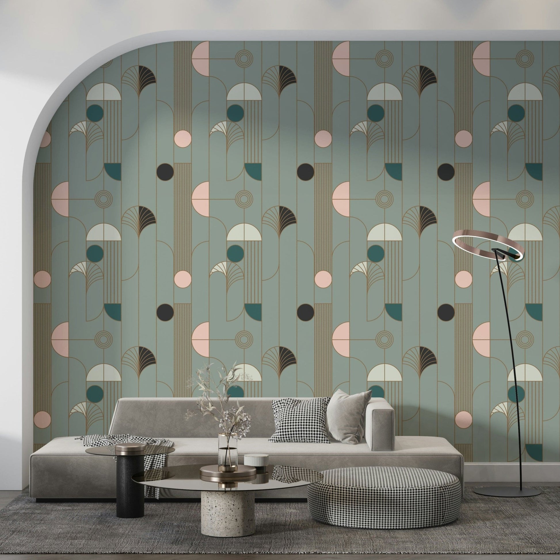 Art Deco Geometric Harmony wallpaper in sage deco shapes on an arch wall behind a grey sofa and houndstooth ottoman
