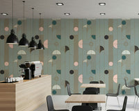 Art Deco Geometric Harmony wallpaper in sage green and gold deco pattern in a cafe with espresso bar and black pendants