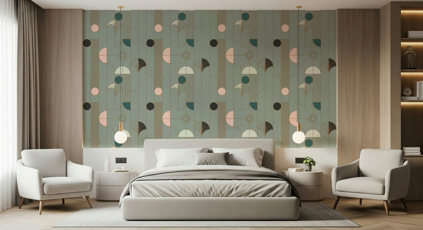 Art Deco Geometric Harmony wallpaper in green deco shapes behind a grey bed with two cream armchairs and globe lamps