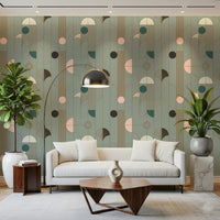 Art Deco Geometric Harmony wallpaper in sage and gold deco pattern behind a white sofa with walnut triangular table
