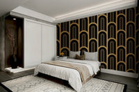 Geometric pattern mural with gold arch designs on black.


