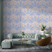 Artdeco Blue Palm Wallpaper in a living room with a green tufted sofa using premium peel and stick material.