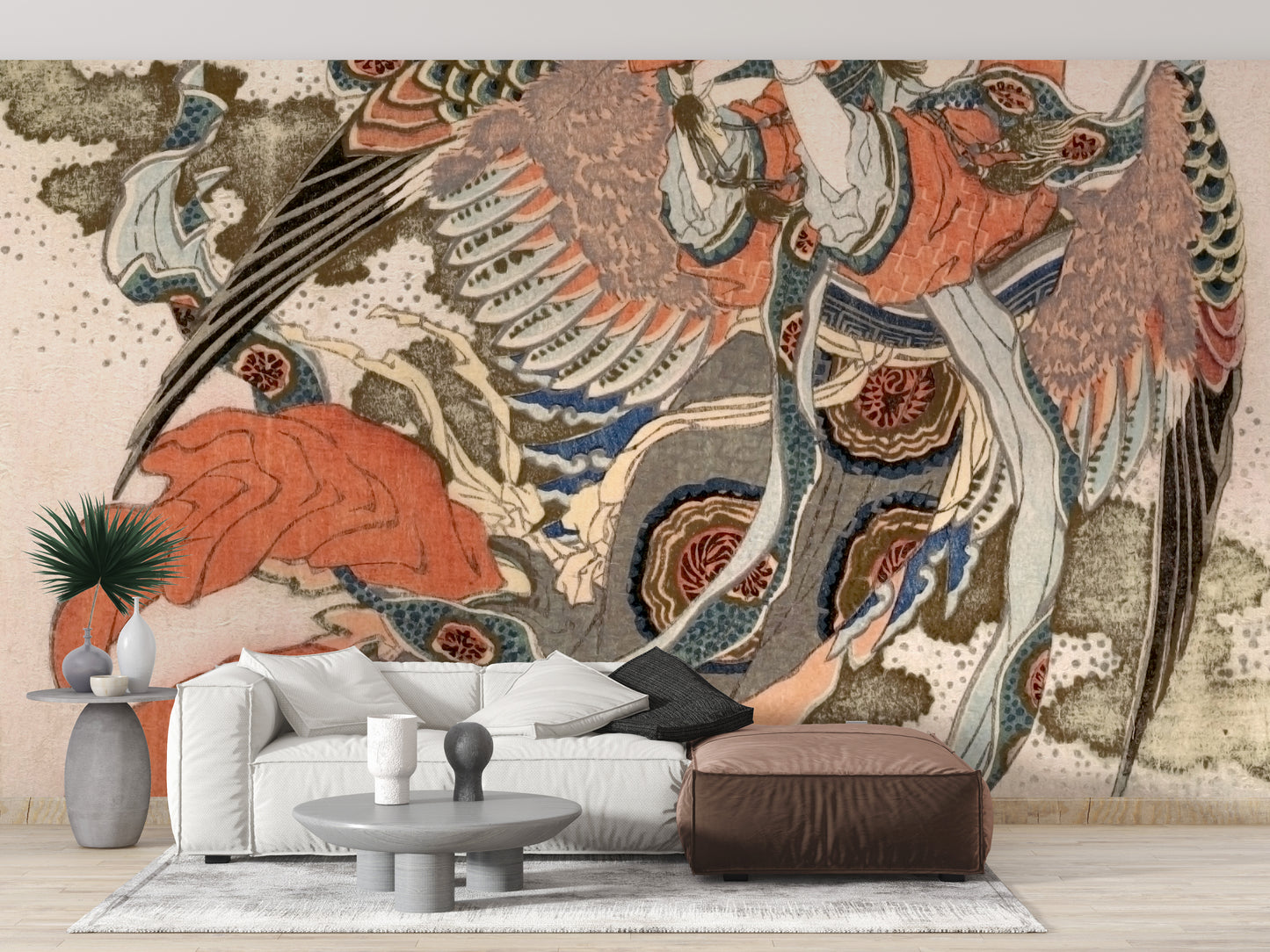 Asian Angel wallpaper mural in terracotta and blue tones above a white sofa and brown leather ottoman in a living room