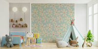 Vintage-inspired wallpaper with bold atomic flower bursts on a pastel teal background.