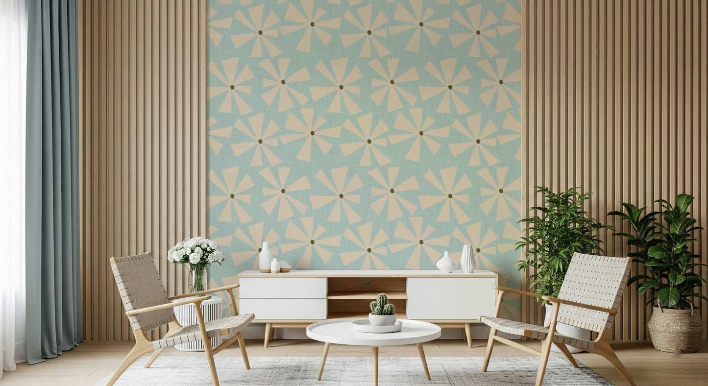 Mid-century inspired wallpaper with geometric pinwheel blooms in cream over a pastel blue backdrop.