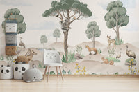 A nursery decorated with a wildlife mural

