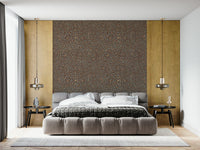 Warm-toned wallpaper mural with intricate autumn-inspired starburst clusters.