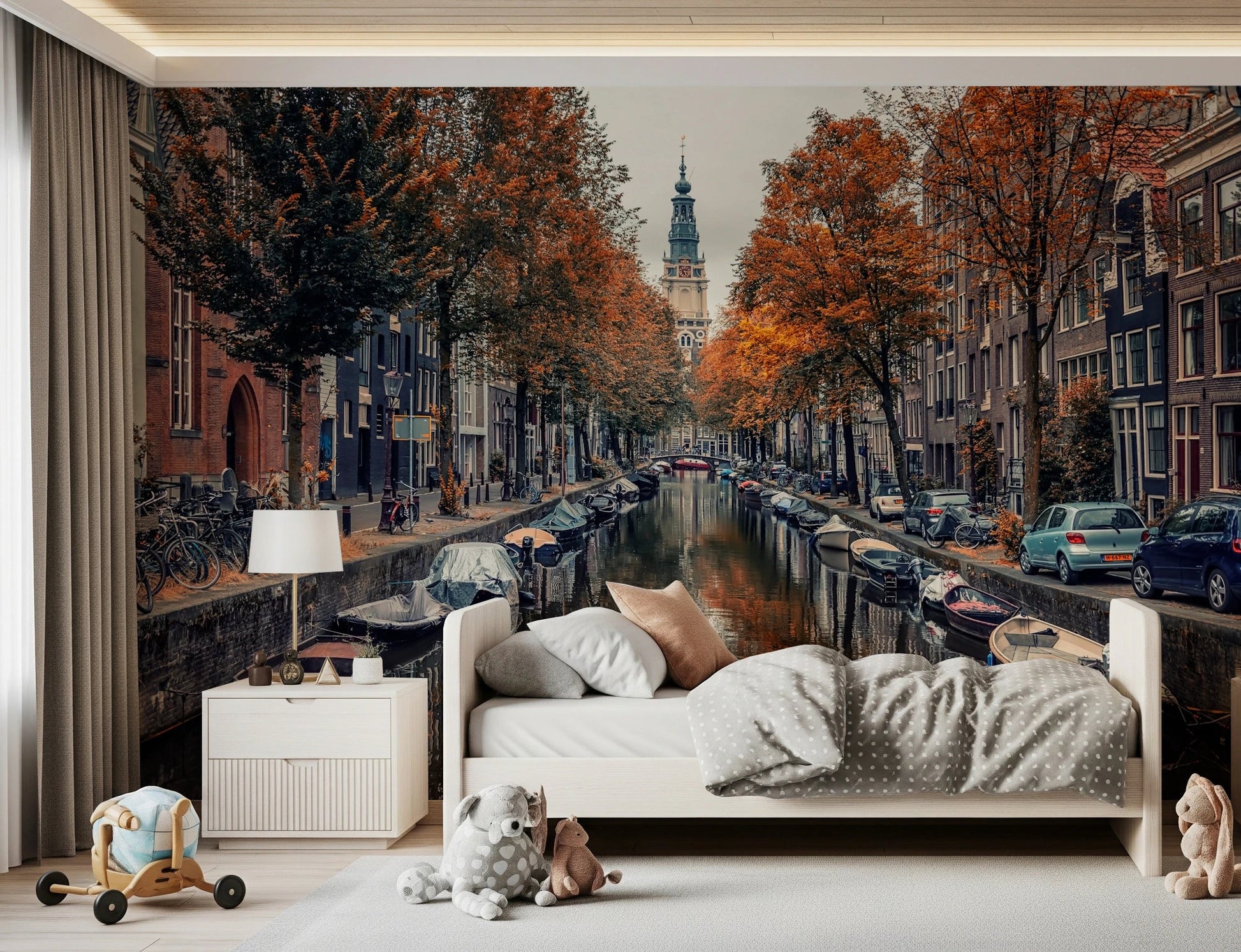 Autumn Canal Charm wallpaper mural of a canal with autumn trees above a single bed with plush toys in a child's room