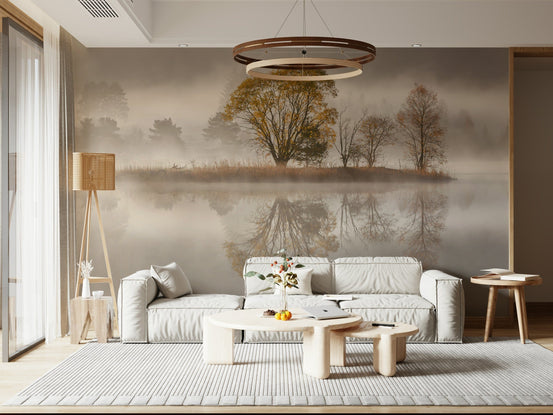 Autumnal Serenity wallpaper mural of a misty lake and golden tree island behind a cream sofa and wood coffee tables in a living room