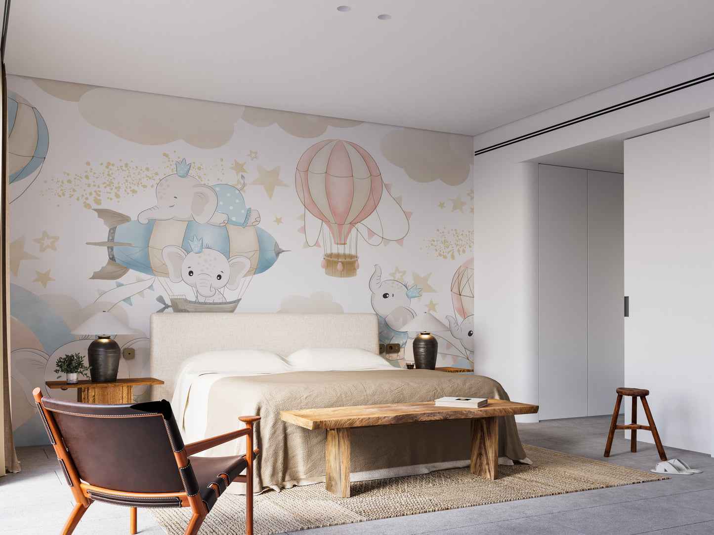 Baby Elephant Sky Adventure mural with pastel elephants in hot air balloons above an upholstered bed