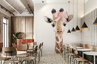 Playful baby giraffe mural with bow in watercolor style