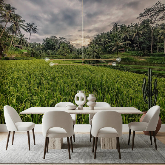 Bali Harvest wall mural of green rice terraces and palms behind a white dining table and cream chairs