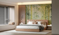 Bamboo Forest Serenity wallpaper mural in green above a tan upholstered bed in a calm bedroom