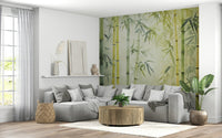 Bamboo Forest Serenity wallpaper mural in green behind a grey L-shaped sectional and round wood table