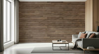 Barn Wood Beauty wallpaper mural in brown wood planks behind a gray sofa with rust pillows and curtains