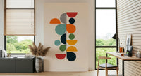Bauhaus Spring wallpaper mural of colorful shapes beside a wood desk and window in a home office