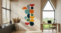 Bauhaus Spring wallpaper mural with stacked geometric shapes beside a wood desk in a home office