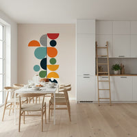 Bauhaus Spring wallpaper mural beside a white marble dining table and wishbone chairs in a kitchen