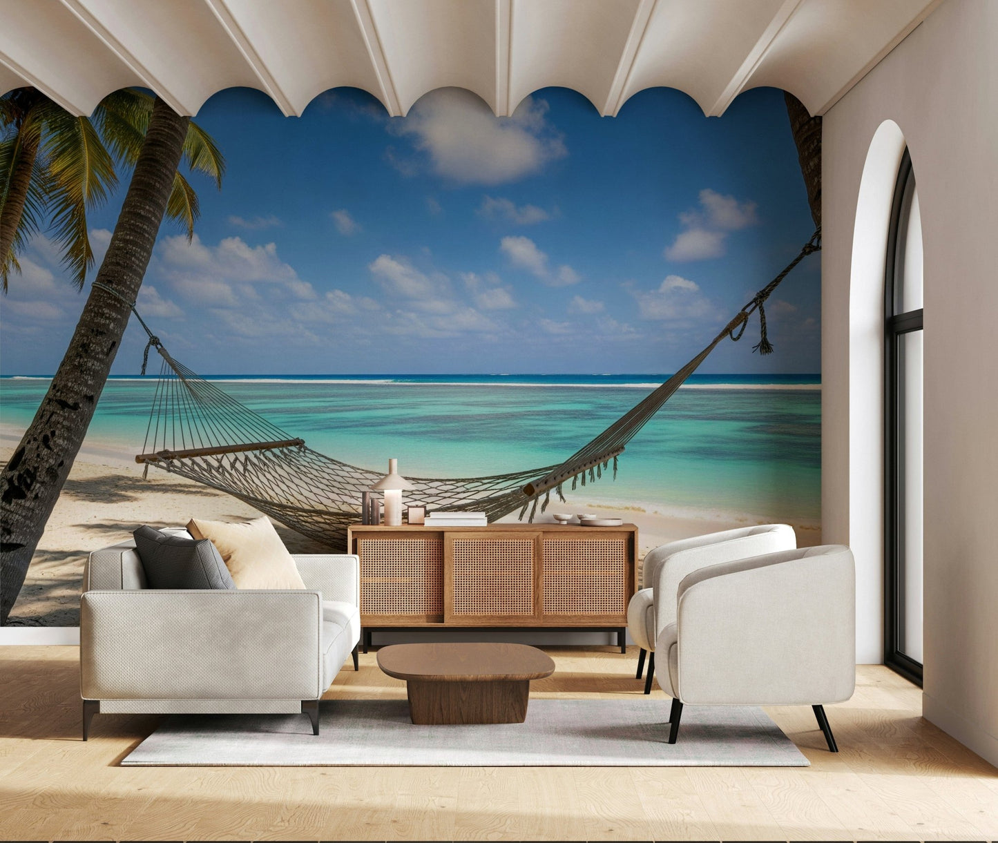 Beach Hammock Haven wallpaper mural of palms and a lagoon behind a white sofa and rattan sideboard in a living room