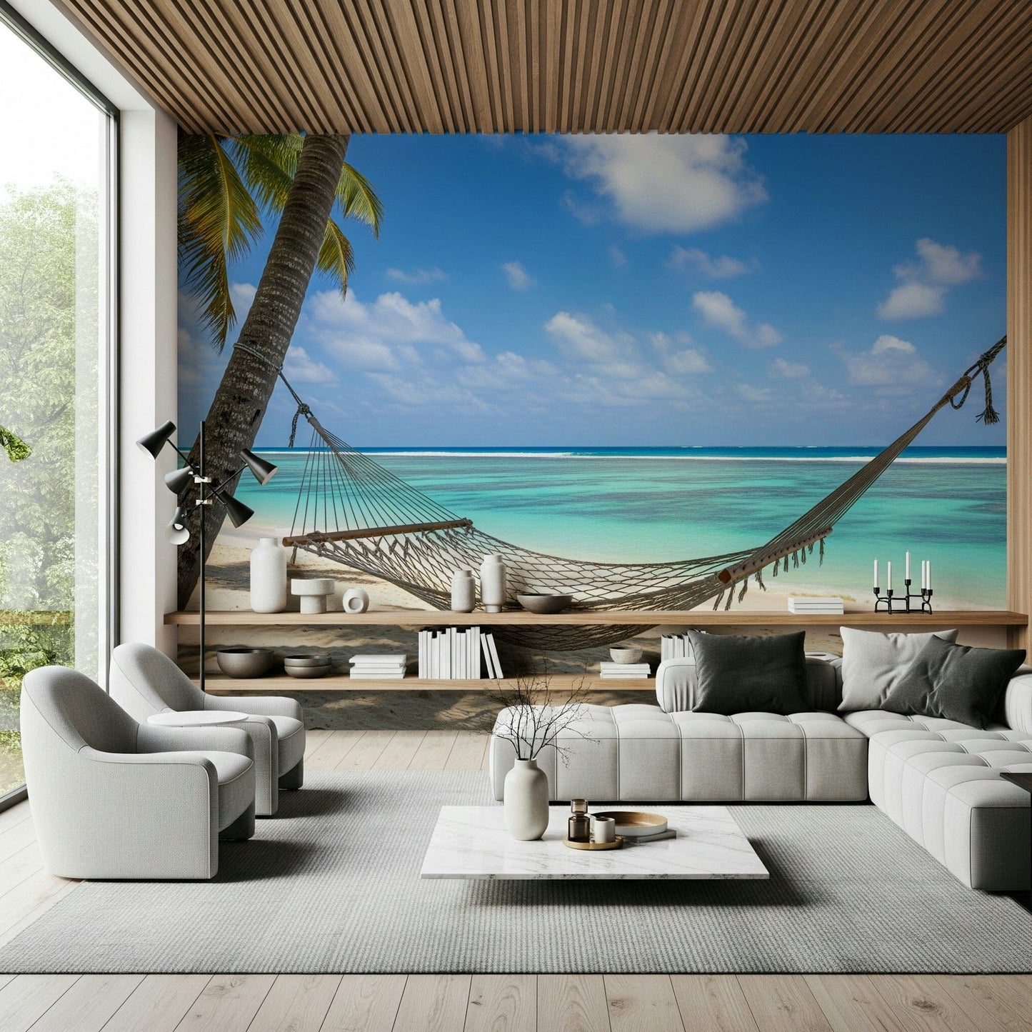 Beach Hammock Haven wallpaper mural of a hammock over a turquoise sea behind a grey sofa and cream armchairs in a living room