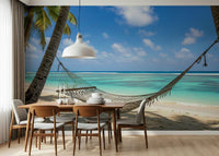 Beach Hammock Haven wallpaper mural of a hammock over turquoise sea behind a wood dining table and grey chairs
