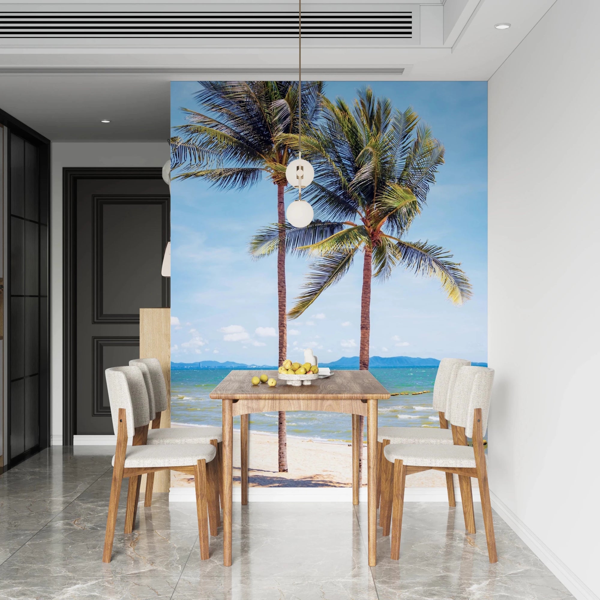 Beachfront Bliss wallpaper mural of two palm trees on a tropical beach behind a wood dining table and cream chairs