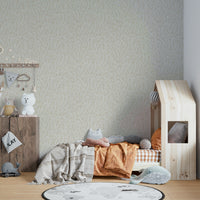 Soft beige wallpaper with a leafy botanical design

