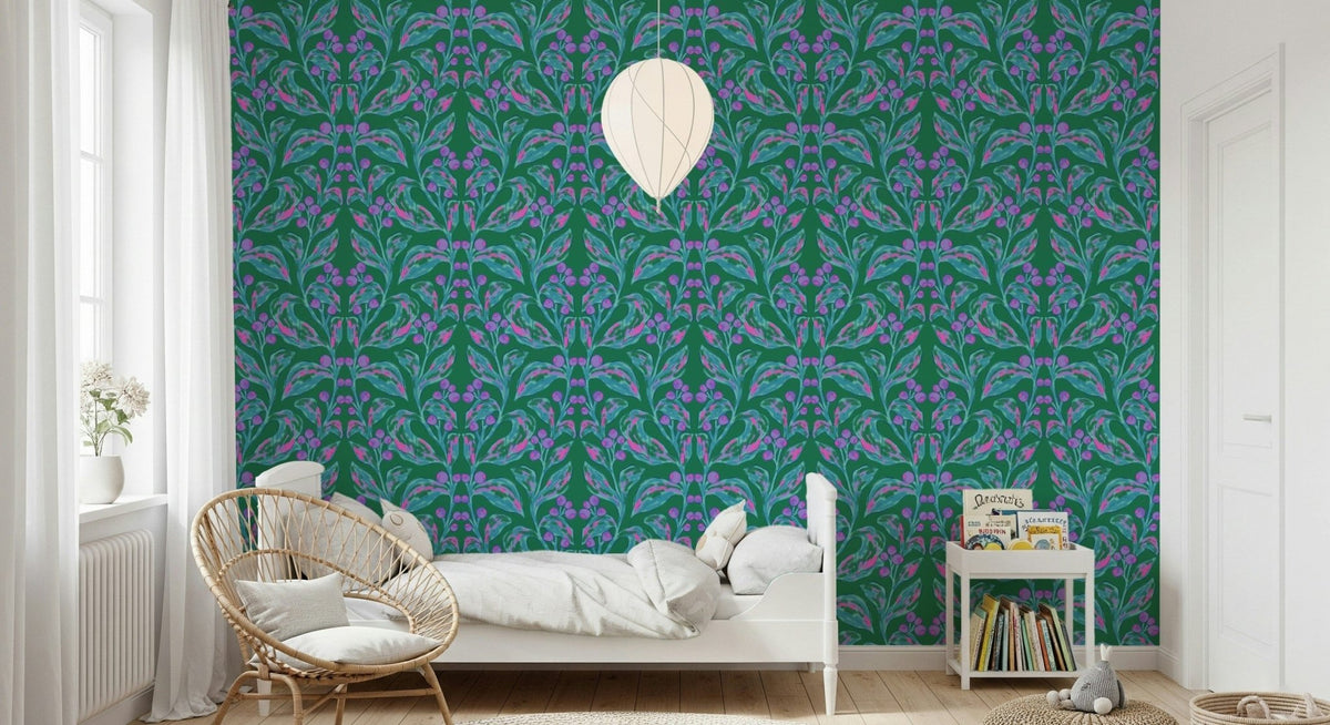 Berry Branch Symphony wallpaper in green and purple behind a white bed and rattan papasan chair