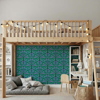 Berry Branch Symphony wallpaper under a wooden loft bed above a grey floor mattress in a kids room