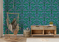 Berry Branch Symphony wallpaper behind a hanging hammock chair and wooden sideboard in a kids room
