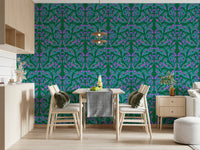 Berry Branch Symphony wallpaper of teal branches and purple berries on green behind a wooden dining table
