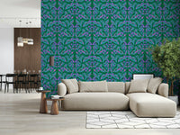 Berry Branch Symphony wallpaper behind a beige sectional sofa with a tall tree in an open living room
