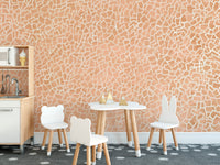 Contemporary pink geometric mosaic wall mural with white details.
