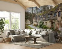 A small, clear stream and a wet, unpaved road run alongside the cottages.

