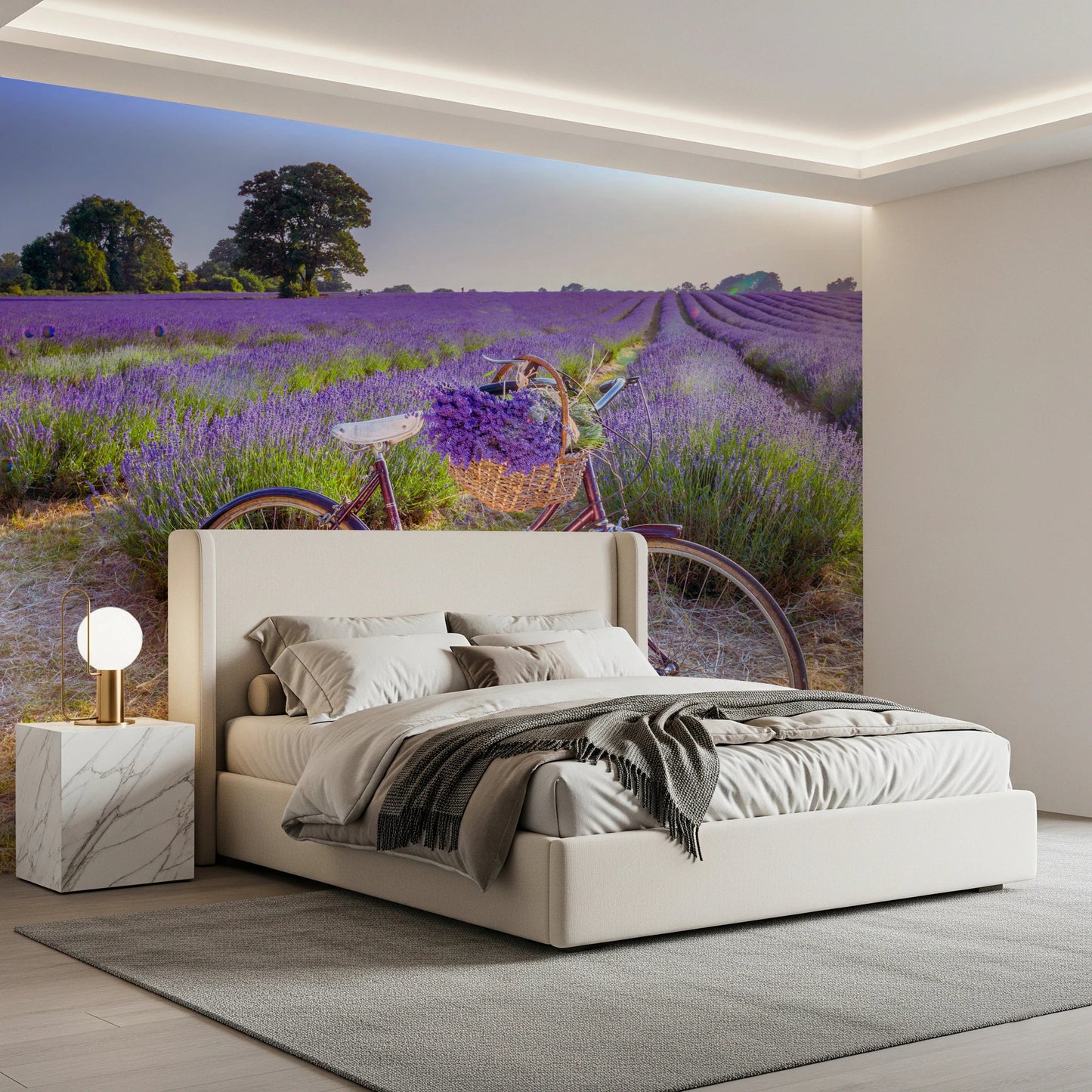 Bicycle in Lavender field wallpaper mural showing a bike in purple lavender behind a cream upholstered bed in a bedroom