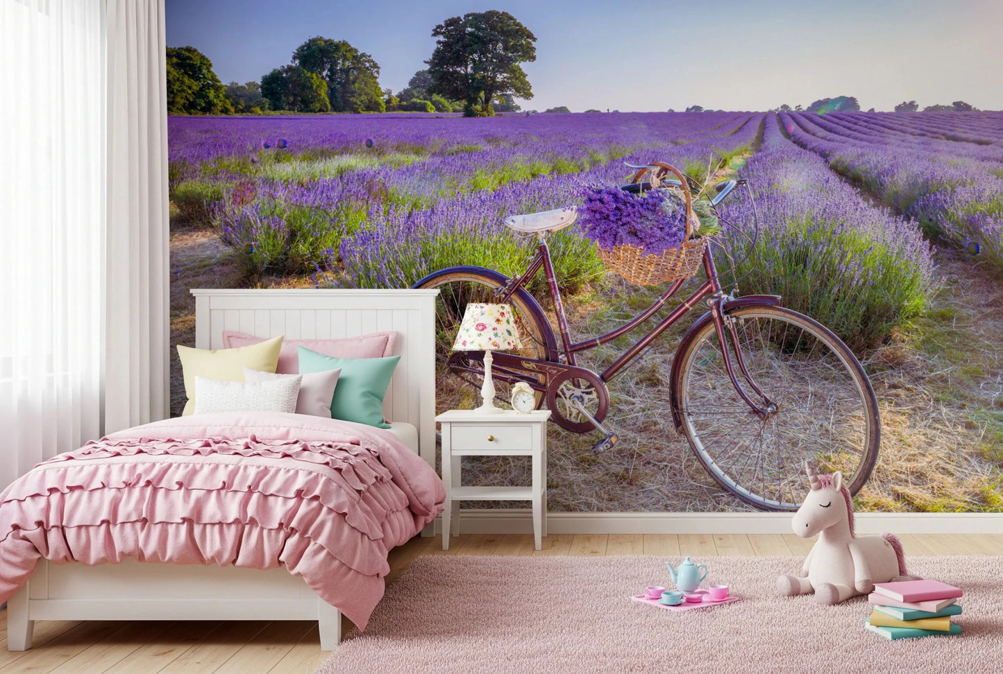 Bicycle in Lavender field wallpaper mural of a bike in lavender above a pink bed and unicorn toy in a girls bedroom