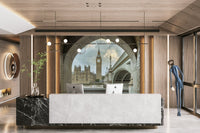 Framed through a rustic stone archway.

