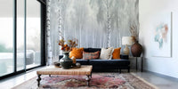 Birch Whispers Wall Mural behind sofa in apartment lounge, light grey and white tones, feature wall