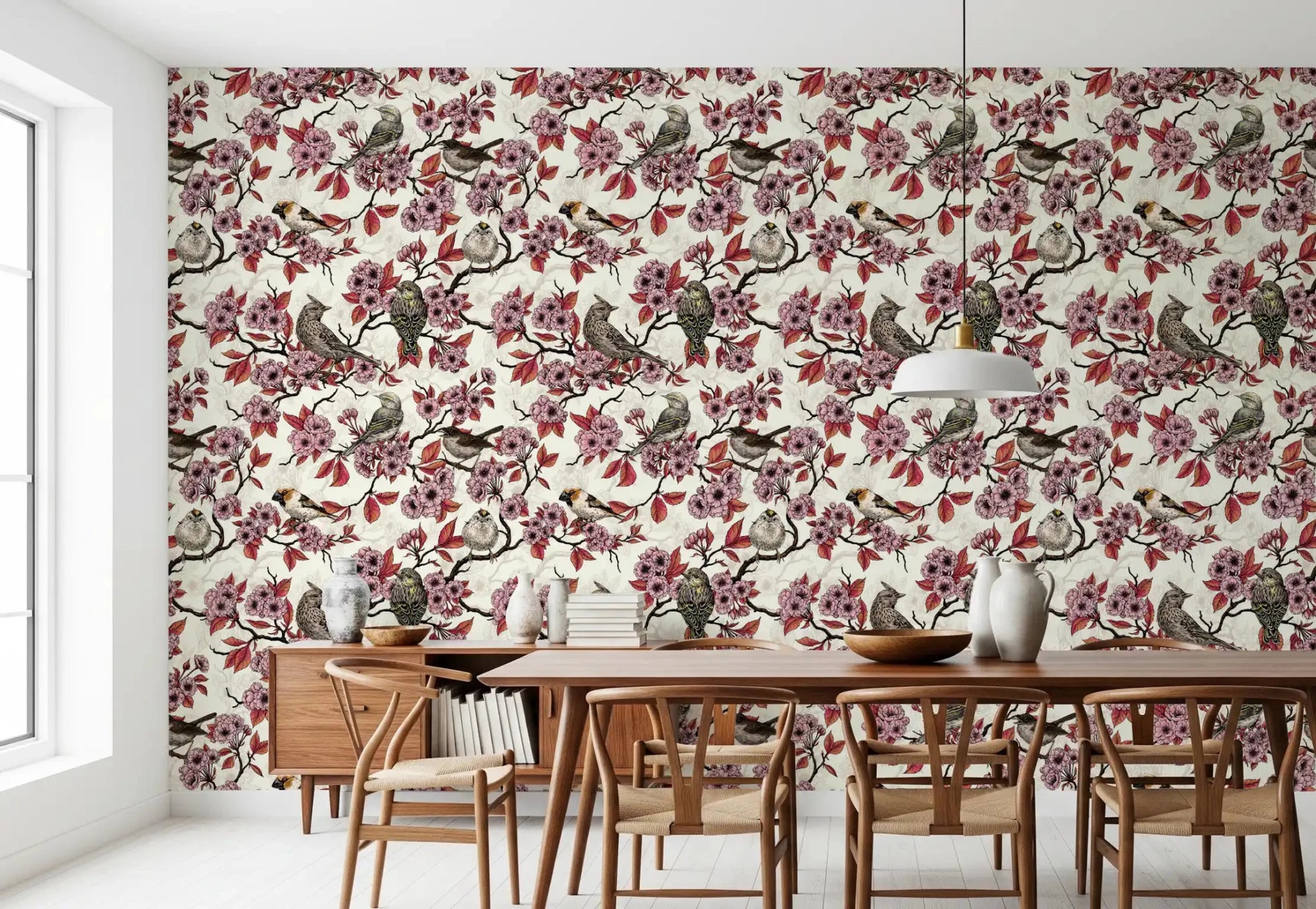 Dining room in botanical bird wallpaper with pink blooms